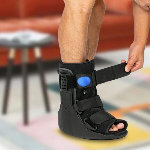 Air Walker Cam Fracture Boot, and its uses and benefits primarily revolve around supporting and immobilizing the foot and ankle during recovery from various injuries. Uses: Injury Management: Ideal for stable fractures of the foot or ankle, Grade II & III sprains, and soft tissue injuries. Post-Operative Stabilization: Provides necessary support and immobilization following surgery on the foot or ankle. Achilles Tendon Ruptures: Offers robust support for individuals recovering from Achilles tendon ruptures. Benefits: Enhanced Stabilization and Immobilization: The adjustable air bladder allows for custom compression, reducing movement and supporting the affected area efficiently compared to traditional casts. Promotes Natural Gait: The rocker bottom sole facilitates a smooth, natural walking rhythm, reducing strain and aiding recovery. Comfort and Pain Reduction: Features like a shock-absorbing insole and customizable compression enhance comfort and help reduce pain during the healing process. Versatility: Suitable for a wide range of foot and ankle conditions and injuries. Breathable Design: Open-toe construction allows for airflow, keeping the foot cool and dry. Adjustable and Universal Fit: Adjustable Velcro straps ensure a secure, tailored fit and the boot is designed to be universal for both left and right feet.