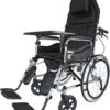 The wheelchair in the image is a high-back manual wheelchair, identified as a Wollex W213 or similar model, with several key features. Adjustable and Reclining Design: The wheelchair has a high backrest that can be reclined and a headrest for support. The footrests are also adjustable and can be raised. Removable Components: The armrests and footrests are detachable, which can make it easier for the user to transfer in and out of the chair. Tray: A removable tray is attached to the armrests, providing a surface for activities or meals. Braking System: The wheelchair includes a companion brake system, which allows an attendant to control the chair's speed and stop it. Durability and Portability: The frame is made of steel, and the wheelchair is foldable for easy storage and transportation.