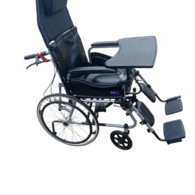 The wheelchair in the image is a high-back manual wheelchair, identified as a Wollex W213 or similar model, with several key features. Adjustable and Reclining Design: The wheelchair has a high backrest that can be reclined and a headrest for support. The footrests are also adjustable and can be raised. Removable Components: The armrests and footrests are detachable, which can make it easier for the user to transfer in and out of the chair. Tray: A removable tray is attached to the armrests, providing a surface for activities or meals. Braking System: The wheelchair includes a companion brake system, which allows an attendant to control the chair's speed and stop it. Durability and Portability: The frame is made of steel, and the wheelchair is foldable for easy storage and transportation.