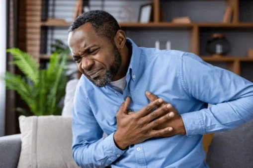 person demonstrating a heart attack may exhibit1 severe chest pain or pressure (often in the center or left side of the chest) that feels like squeezing, fullness, or aching. This pain may radiate to the arms (commonly the left), back, neck, jaw, or 